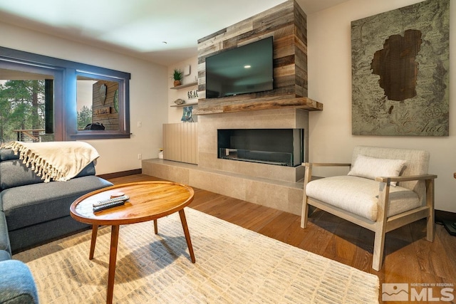 17 Beach Club Dr Unit 221, Stateline, NV 89449 - living area with wood finished floors, a fireplace, and baseboards