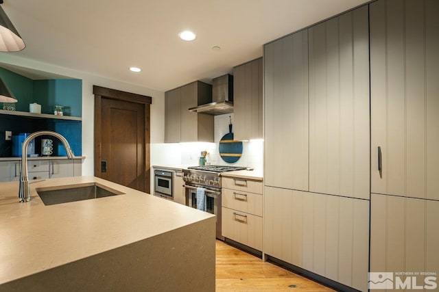 17 Beach Club Dr Unit 221, Stateline, NV 89449 - kitchen with wall chimney exhaust hood, high end range, a sink, recessed lighting, and light countertops