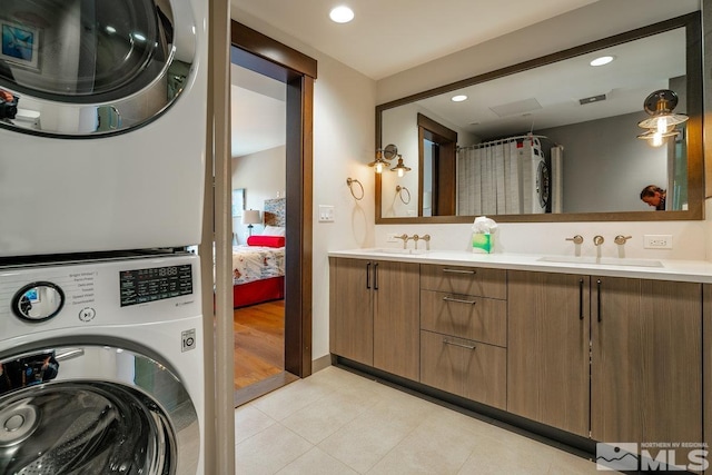 17 Beach Club Dr Unit 221, Stateline, NV 89449 - ensuite bathroom featuring stacked washer and clothes dryer, recessed lighting, double vanity, and tile patterned floors