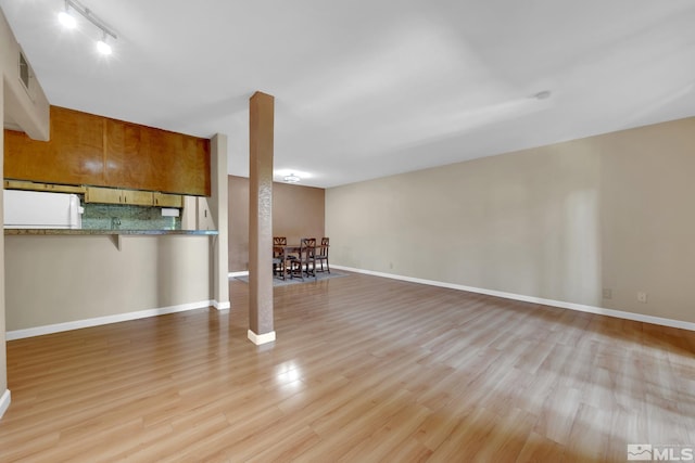 1000 Beck St Unit 251, Reno, NV 89509 - unfurnished living room with light wood-style flooring and baseboards