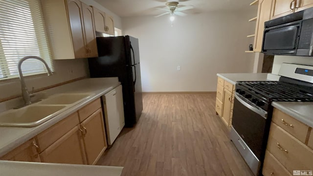2602 William Ave, South Lake Tahoe, CA 96150 - kitchen with black appliances, a sink, a ceiling fan, light wood-style flooring, and light countertops