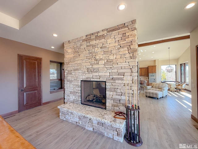 46 Silver Lynx Way, Verdi, NV 89439 - living area featuring a fireplace, light wood finished floors, baseboards, and recessed lighting