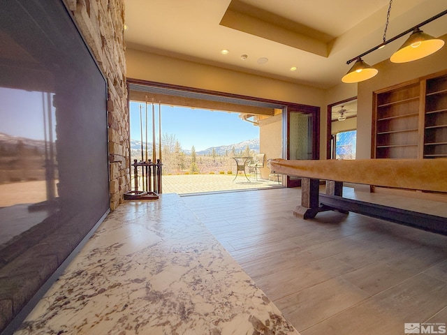 46 Silver Lynx Way, Verdi, NV 89439 - recreation room with a mountain view, plenty of natural light, recessed lighting, built in features, and wood finished floors