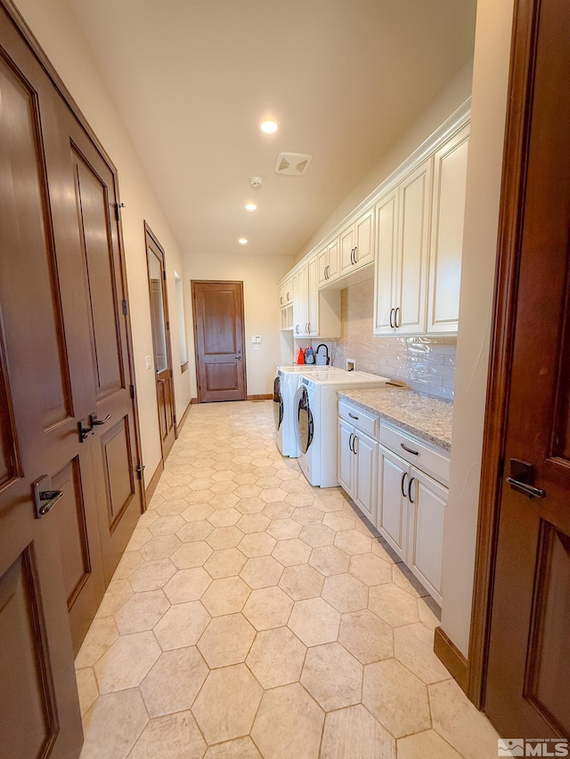 46 Silver Lynx Way, Verdi, NV 89439 - laundry room with cabinet space, separate washer and dryer, recessed lighting, light flooring, and baseboards