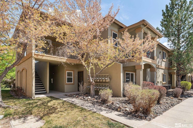 6850 Sharlands Ave Unit Y1149, Reno, NV 89523 - view of front of property with stairs, stucco siding, and a balcony