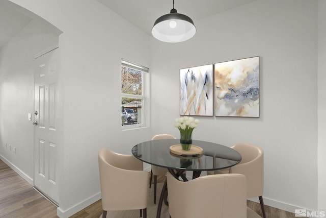 6850 Sharlands Ave Unit Y1149, Reno, NV 89523 - dining area with baseboards, wood finished floors, and arched walkways