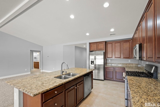7760 Sonic Ct, Sparks, NV 89436 - kitchen featuring stainless steel appliances, a sink, an island with sink, light stone countertops, and recessed lighting