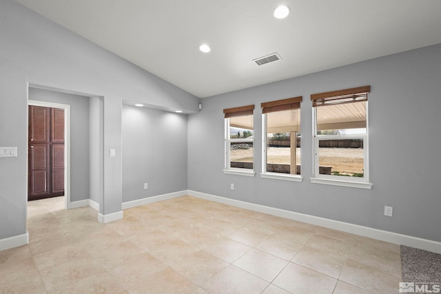 7760 Sonic Ct, Sparks, NV 89436 - spare room with recessed lighting, lofted ceiling, baseboards, and light tile patterned floors