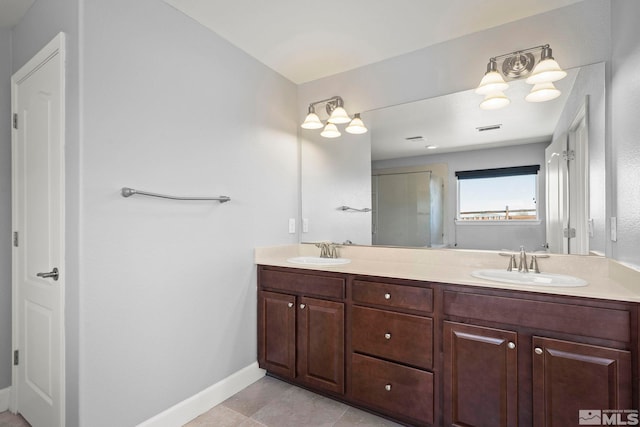 7760 Sonic Ct, Sparks, NV 89436 - bathroom with double vanity, baseboards, a shower stall, and tile patterned flooring