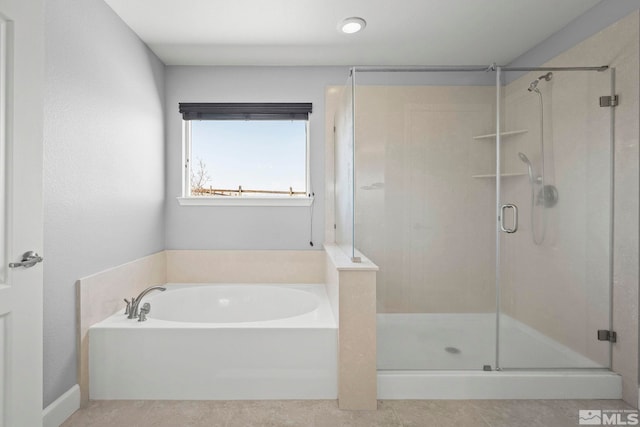7760 Sonic Ct, Sparks, NV 89436 - bathroom featuring a bath, a stall shower, and tile patterned floors