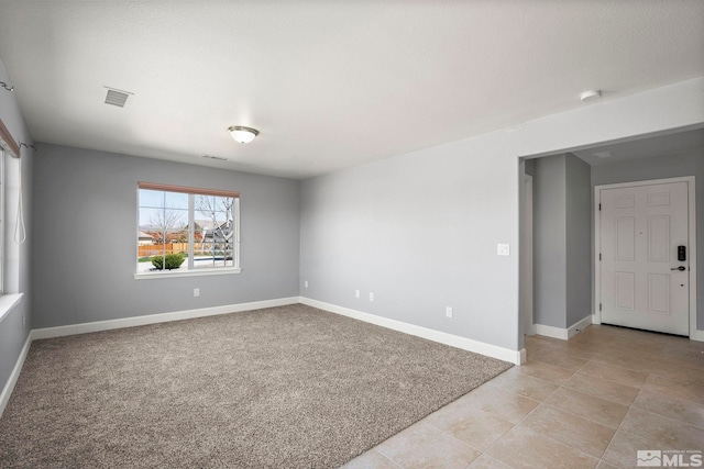 7760 Sonic Ct, Sparks, NV 89436 - unfurnished room with baseboards, light tile patterned floors, a smoke detector, and light carpet