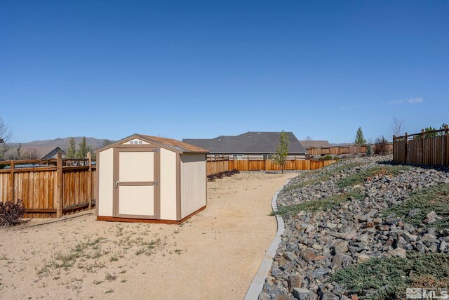 7760 Sonic Ct, Sparks, NV 89436 - view of shed with a fenced backyard and a mountain view
