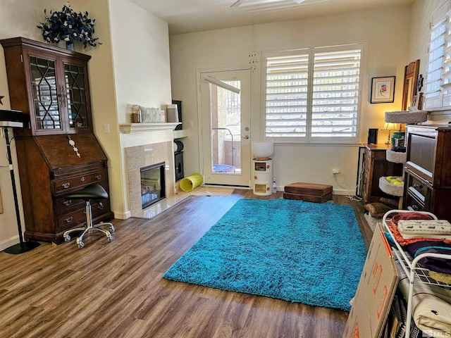 900 S Meadows Pkwy Unit 5414, Reno, NV 89521 - sitting room featuring wood finished floors, a premium fireplace, and baseboards