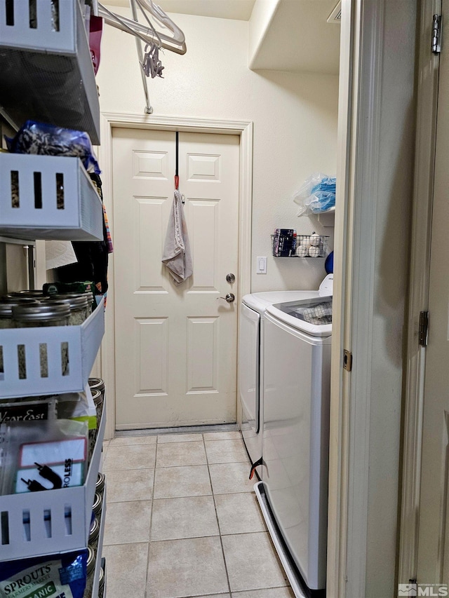 900 S Meadows Pkwy Unit 5414, Reno, NV 89521 - washroom featuring independent washer and dryer and light tile patterned floors