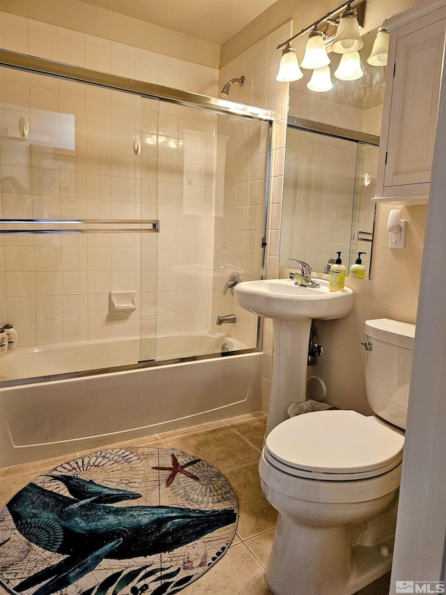 900 S Meadows Pkwy Unit 5414, Reno, NV 89521 - bathroom with toilet, tile patterned flooring, and combined bath / shower with glass door