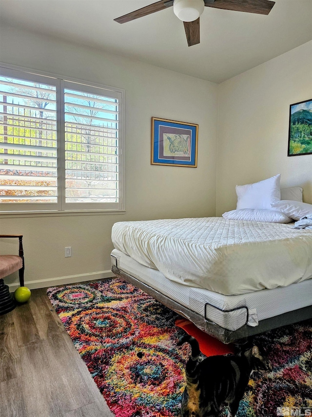 900 S Meadows Pkwy Unit 5414, Reno, NV 89521 - bedroom featuring baseboards, wood finished floors, and a ceiling fan