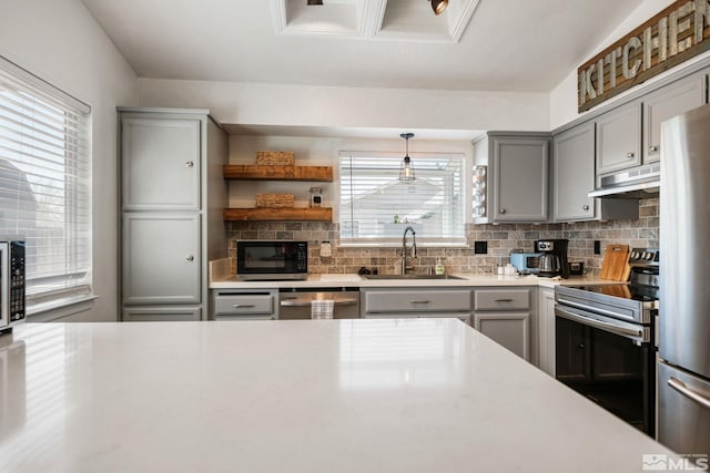 119 River Village Cir, Dayton, NV 89403 - kitchen with gray cabinetry, stainless steel appliances, a sink, and under cabinet range hood