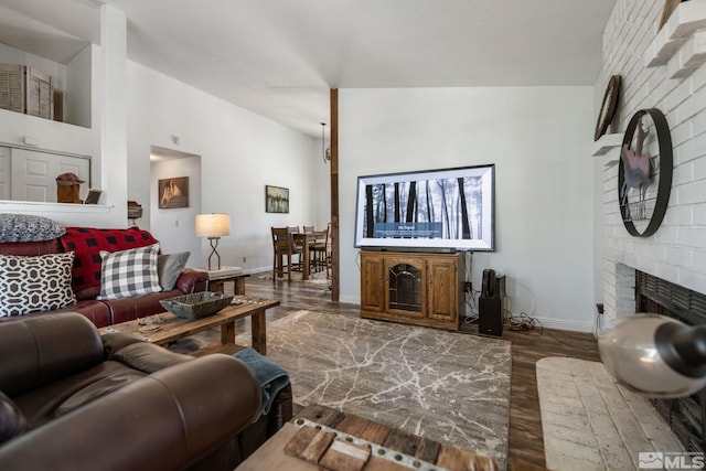 119 River Village Cir, Dayton, NV 89403 - living area with a brick fireplace, baseboards, and wood finished floors