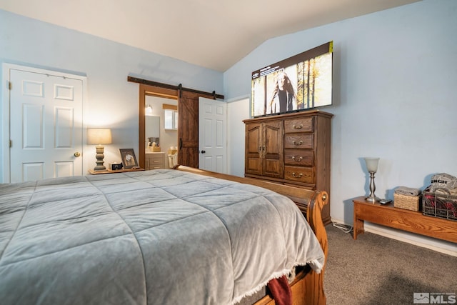 119 River Village Cir, Dayton, NV 89403 - bedroom with lofted ceiling, a barn door, carpet floors, and ensuite bathroom