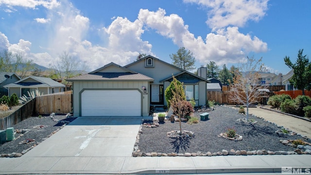 119 River Village Cir, Dayton, NV 89403 - view of front of house featuring an attached garage, concrete driveway, fence, and board and batten siding