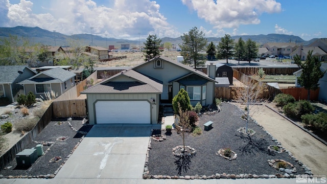 119 River Village Cir, Dayton, NV 89403 - single story home with a mountain view, a residential view, a garage, and fence