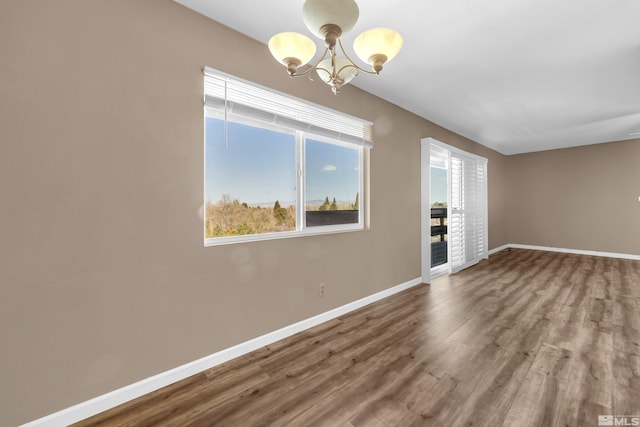 3089 Cashill Blvd, Reno, NV 89509 - unfurnished room featuring plenty of natural light, a chandelier, and baseboards