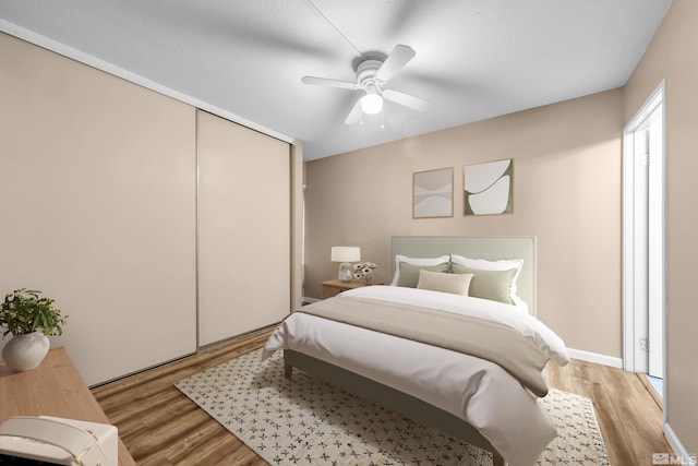 3089 Cashill Blvd, Reno, NV 89509 - bedroom with light wood-style floors, a closet, and a ceiling fan