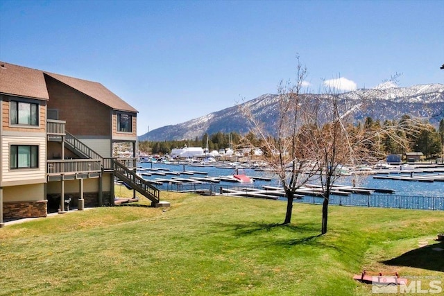 555 Tahoe Keys Blvd Unit 14, South Lake Tahoe, CA 96150 - view of grassy yard featuring stairs and a water and mountain view