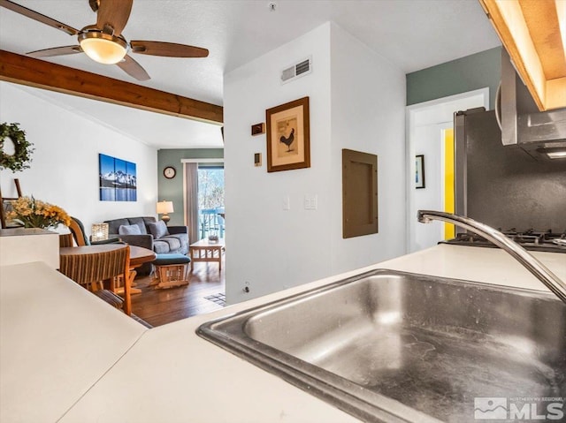 555 Tahoe Keys Blvd Unit 14, South Lake Tahoe, CA 96150 - kitchen featuring a sink, electric panel, ceiling fan, wood finished floors, and beam ceiling