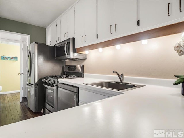 555 Tahoe Keys Blvd Unit 14, South Lake Tahoe, CA 96150 - kitchen featuring stainless steel appliances, a sink, white cabinetry, light countertops, and dark wood-type flooring