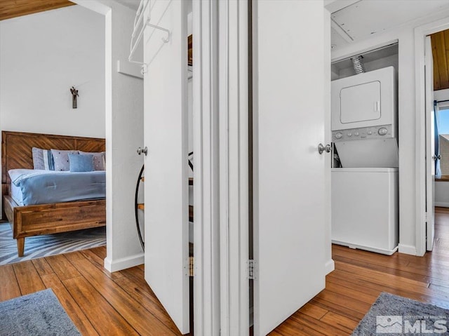 555 Tahoe Keys Blvd Unit 14, South Lake Tahoe, CA 96150 - corridor featuring estacked washer and dryer, hardwood / wood-style floors, and baseboards