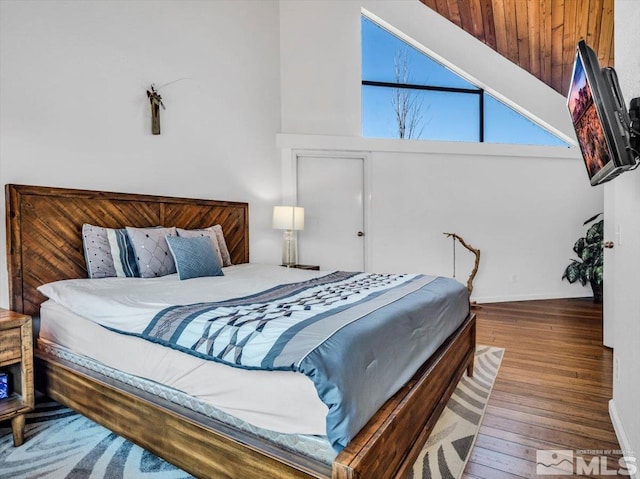 555 Tahoe Keys Blvd Unit 14, South Lake Tahoe, CA 96150 - bedroom with wood finished floors, baseboards, and high vaulted ceiling