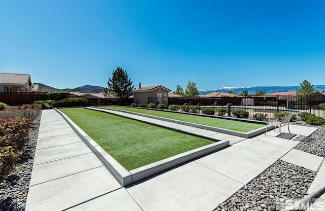 1360 Veneto Dr, Sparks, NV 89434 - view of home's community with a bocce ball area, fence, and a mountain view