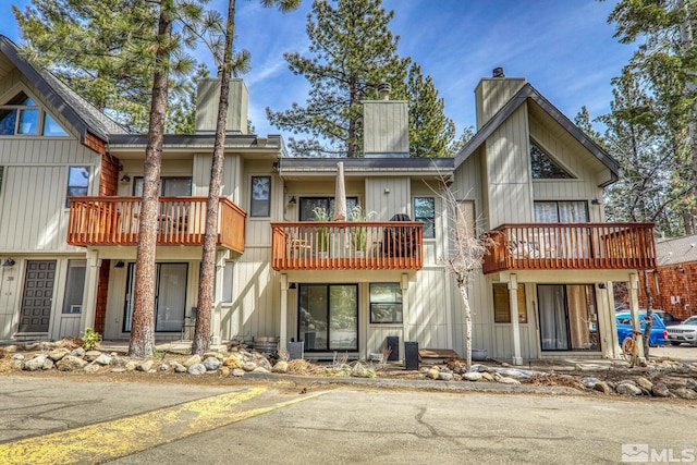 989 Tahoe Blvd Unit 36, Incline Village, NV 89451 - rear view of property with a chimney and a balcony