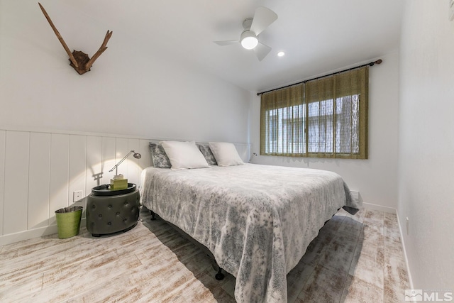 989 Tahoe Blvd Unit 36, Incline Village, NV 89451 - bedroom with wood finished floors, a wainscoted wall, a ceiling fan, and a decorative wall