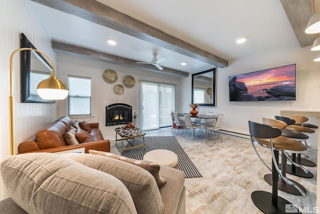 989 Tahoe Blvd Unit 36, Incline Village, NV 89451 - living area featuring a tile fireplace, light wood-style flooring, beam ceiling, baseboards, and ceiling fan