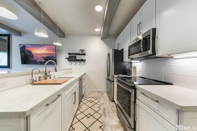 989 Tahoe Blvd Unit 36, Incline Village, NV 89451 - kitchen with stainless steel appliances, a sink, tasteful backsplash, a peninsula, and recessed lighting