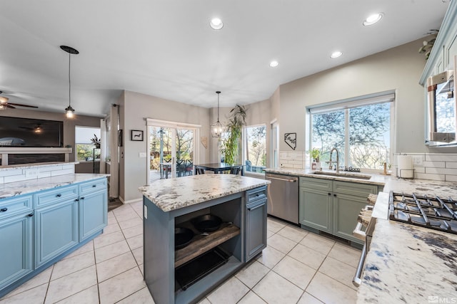 2900 Ariel Dr, Reno, NV 89523 - kitchen with stainless steel appliances, a sink, recessed lighting, plenty of natural light, and light tile patterned flooring