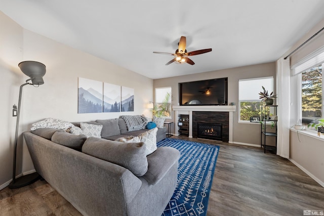 2900 Ariel Dr, Reno, NV 89523 - living room featuring ceiling fan, a lit fireplace, baseboards, and wood finished floors