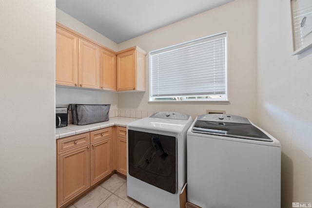 2900 Ariel Dr, Reno, NV 89523 - laundry room with washer and dryer, cabinet space, and light tile patterned flooring