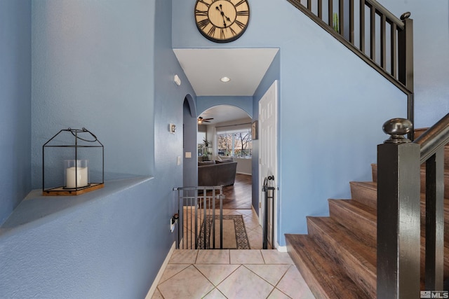 2900 Ariel Dr, Reno, NV 89523 - stairs with arched walkways and tile patterned flooring
