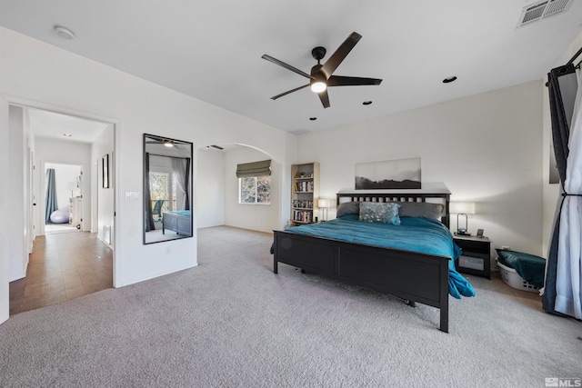 2900 Ariel Dr, Reno, NV 89523 - bedroom featuring carpet, arched walkways, and a ceiling fan