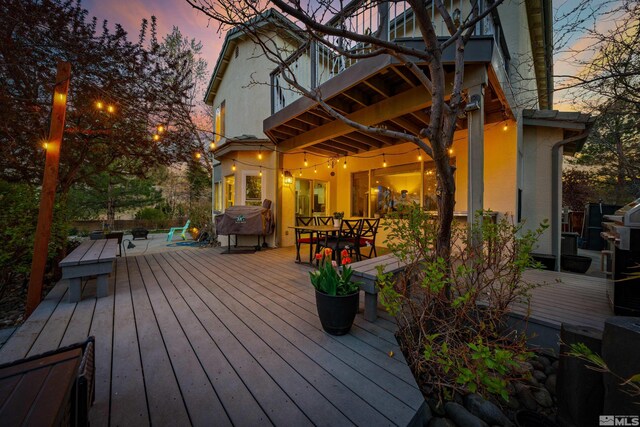 2900 Ariel Dr, Reno, NV 89523 - deck at dusk featuring outdoor dining space