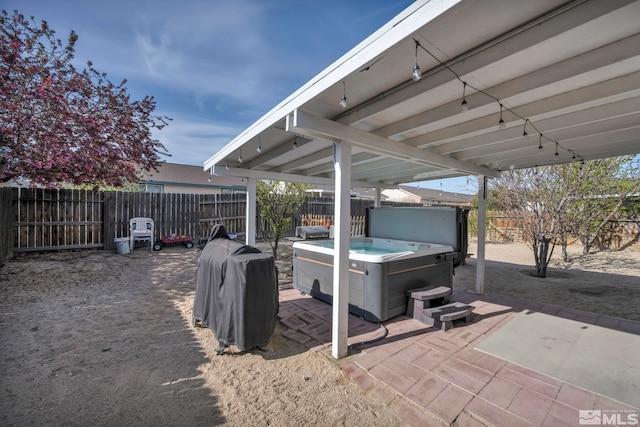 233 Jennys Ln, Fernley, NV 89408 - view of patio featuring a hot tub and a fenced backyard
