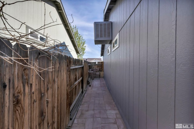 233 Jennys Ln, Fernley, NV 89408 - view of side of home with fence and cooling unit
