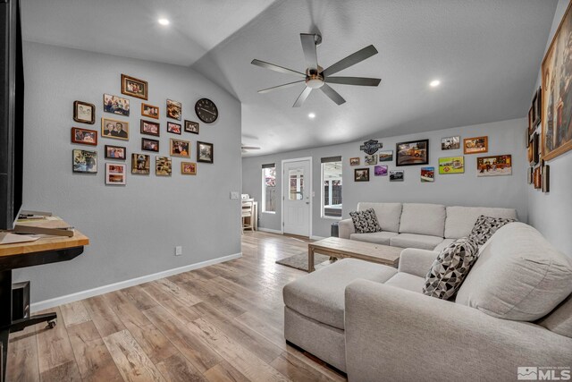 233 Jennys Ln, Fernley, NV 89408 - living room featuring ceiling fan, lofted ceiling, baseboards, light wood-style flooring, and recessed lighting