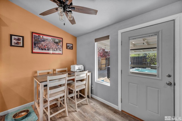 233 Jennys Ln, Fernley, NV 89408 - dining room with wood finished floors, lofted ceiling, baseboards, and ceiling fan