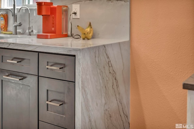 233 Jennys Ln, Fernley, NV 89408 - detailed view of a textured wall, a sink, and tasteful backsplash