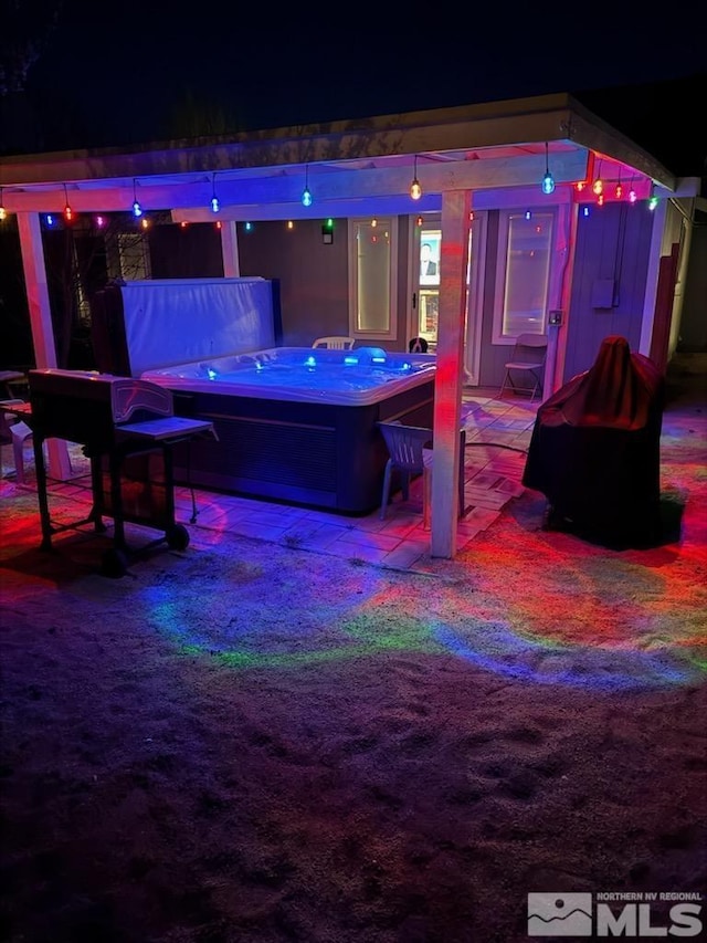 233 Jennys Ln, Fernley, NV 89408 - patio at night with a hot tub
