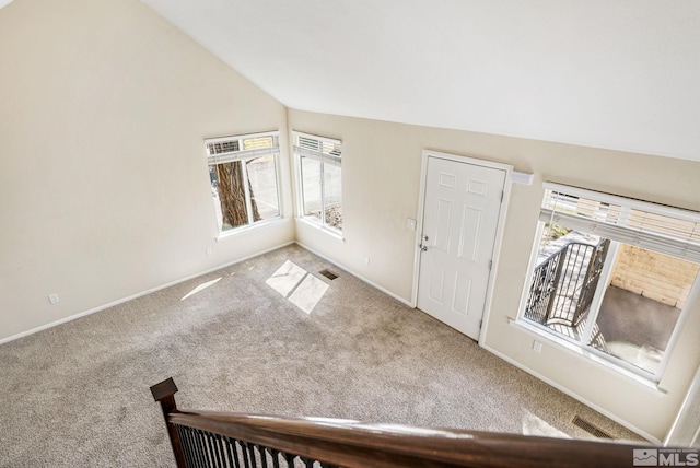 3924 Pheasant Dr, Carson City, NV 89701 - foyer entrance featuring vaulted ceiling, carpet flooring, plenty of natural light, and baseboards